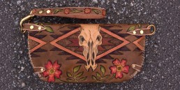Cow skull clutch with navajo designs & wild roses, carved leather by Joren Eulalee Back View